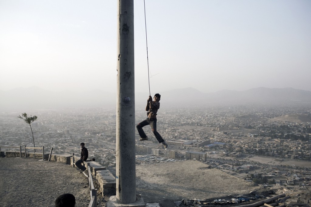 Afghanistan, August 2008. Children play on a hill overlooking Kabul. Photo by Moises Saman/MAGNUM