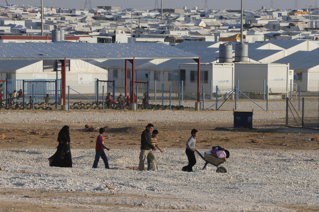 Children earn a living by transporting goods inside the Zaatari Refugee Camp, Jordan. Credit: Mohamed Azakir - World Bank 